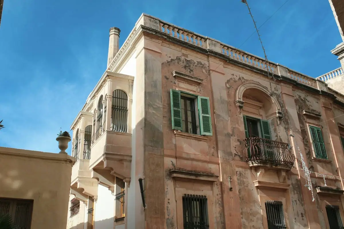 Traditional Maltese townhouse with green shutters