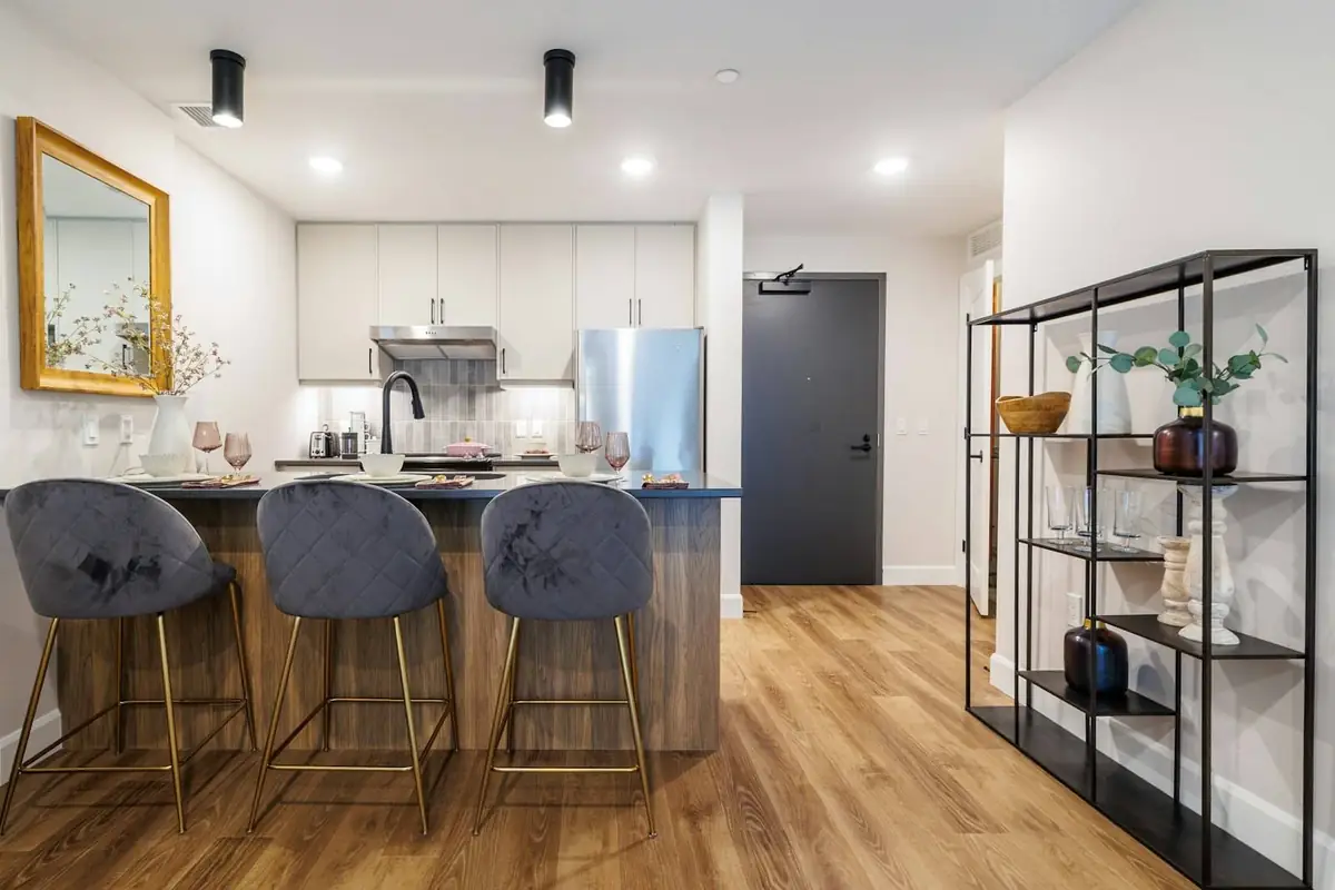 Finished open-plan kitchen with island and wooden floor